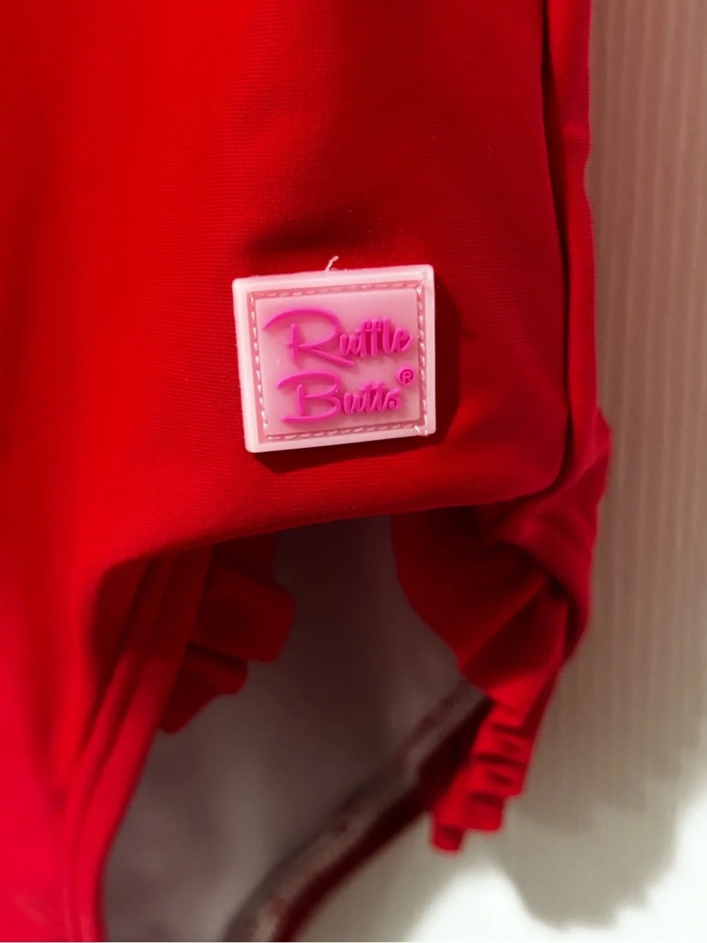 Ruffle Butts Red Girls One-Piece Swimsuit with “B” monogram